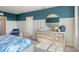 Bright bedroom featuring blue accents, modern decor, and ample natural light at 1336 Hanoverian Dr, Lake Alfred, FL 33850