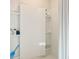 Shower with recessed shelves and a shower curtain at 1336 Hanoverian Dr, Lake Alfred, FL 33850