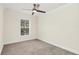 Simple bedroom with neutral walls, carpet flooring, and a window at 1347 Benevolent St, Maitland, FL 32751