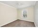 Bedroom featuring neutral walls, carpet flooring, a ceiling fan, and natural light from the window at 1347 Benevolent St, Maitland, FL 32751