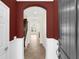 View of the home's foyer with diamond-patterned tile floor, high ceilings, and an arched doorway leading to the staircase at 1347 Benevolent St, Maitland, FL 32751