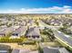 Stunning aerial view of a home with a patio, lush landscaping, and a meticulously maintained lawn in a quiet neighborhood at 1374 Zeek Ridge St, Clermont, FL 34715