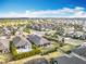 An aerial view of a home featuring a backyard oasis, complete with a patio, lush landscaping, and a private garden at 1374 Zeek Ridge St, Clermont, FL 34715