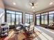 Bright dining area featuring large windows, and a ceiling fan at 1374 Zeek Ridge St, Clermont, FL 34715