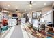 Spacious sitting area showcasing a ceiling fan, comfortable seating, and ample sunlight at 1374 Zeek Ridge St, Clermont, FL 34715