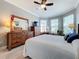 Serene main bedroom with ample natural light and comfortable furnishings at 1374 Zeek Ridge St, Clermont, FL 34715