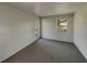 Cozy bedroom with fresh carpet and natural light from two windows at 145 Zacalo Way, Kissimmee, FL 34743