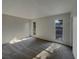 Bedroom with light colored walls and gray carpet with natural light at 145 Zacalo Way, Kissimmee, FL 34743