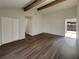 Bright living room with hardwood floors, vaulted ceiling and exposed beams at 145 Zacalo Way, Kissimmee, FL 34743