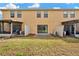 View of backyard featuring a green lawn, patio, and a screened-in porch at 1558 Downy Birch Ln, Longwood, FL 32750