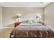 Cozy bedroom featuring neutral walls, plush carpet, and bedside tables with lamps, creating a relaxing atmosphere at 1558 Downy Birch Ln, Longwood, FL 32750