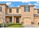 Charming two-story townhome featuring a one-car garage, front garden and welcoming entrance at 1558 Downy Birch Ln, Longwood, FL 32750