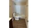 Bathroom featuring a shower-tub combo, new toilet, and modern fixtures at 1583 Montgomery Ave, Holly Hill, FL 32117