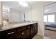 Spacious bathroom with double sinks, granite countertops, and ample lighting at 16207 Trinidad Way, Clermont, FL 34714