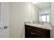 Well-lit bathroom featuring a granite countertop and ample counter space at 16207 Trinidad Way, Clermont, FL 34714