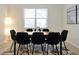 Bright dining room features a modern light fixture, sleek table, and seating for eight, creating an inviting space at 16207 Trinidad Way, Clermont, FL 34714