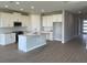 Modern kitchen featuring white cabinets, stainless steel appliances, a center island, and recessed lighting at 16880 Muskgrass Dr, Winter Garden, FL 34787