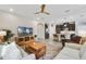 Open-concept living area flowing into modern kitchen with stainless appliances and island seating at 17858 Adrift Rd, Winter Garden, FL 34787