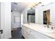 Well-lit bathroom featuring double sinks, a large mirror, and modern fixtures at 181 N Phelps Ave, Winter Park, FL 32789