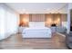 Modern main bedroom featuring hardwood floors, a wall of custom storage, and contemporary lighting at 181 N Phelps Ave, Winter Park, FL 32789