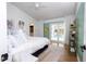 Bright main bedroom with pool access through sliding doors and modern decor at 181 N Phelps Ave, Winter Park, FL 32789