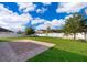 Back yard featuring a grass lawn, pavers and a tree at 1920 Partin Terrace Rd, Kissimmee, FL 34744