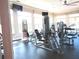 Well-lit gym features modern exercise equipment, large windows, and ceiling fan, offering residents a convenient fitness option at 1920 Partin Terrace Rd, Kissimmee, FL 34744