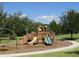 Community playground with slides, climbing structures, and swings set amidst green surroundings, offering a fun recreation space at 1920 Partin Terrace Rd, Kissimmee, FL 34744