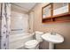 Cozy bathroom with a shower/tub combination, toilet, and sink with mirrored cabinet at 198 Benjamin Dr, Ormond Beach, FL 32176