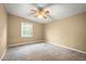 Bedroom with neutral walls, carpet flooring, and one window at 198 Benjamin Dr, Ormond Beach, FL 32176