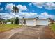 This one-story home has a manicured front lawn and an attached two-car garage at 198 Benjamin Dr, Ormond Beach, FL 32176