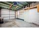 Spacious garage with overhead storage and a secure door at 198 Benjamin Dr, Ormond Beach, FL 32176