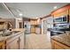 Spacious eat-in kitchen boasts granite countertops, wood cabinets, and stainless steel appliances at 198 Benjamin Dr, Ormond Beach, FL 32176