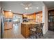 Open kitchen featuring a breakfast bar, granite countertops, and stainless steel appliances at 198 Benjamin Dr, Ormond Beach, FL 32176