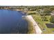 Aerial view of the community waterfront with a beach, pier, picnic area, and playground at 203 E Sweetwater Creek Dr, Longwood, FL 32779