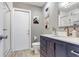 Updated bathroom features new vanity with marble counter and updated fixtures at 203 E Sweetwater Creek Dr, Longwood, FL 32779