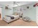 Cozy bedroom with a plush bed, soft carpet, and a ceiling fan at 203 E Sweetwater Creek Dr, Longwood, FL 32779