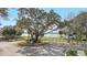 Entrance to Sweetwater Beach, with landscaping, mature trees and access to the beach and lake at 203 E Sweetwater Creek Dr, Longwood, FL 32779