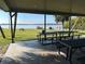 Outdoor picnic area with picnic tables offering tranquil water views and a beautiful place to relax at 203 E Sweetwater Creek Dr, Longwood, FL 32779