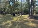 Well maintained community playground and picnic tables surrounded by trees for shady outdoor fun at 203 E Sweetwater Creek Dr, Longwood, FL 32779