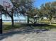 Community playground offers a basketball court, swings, and a slide with waterfront views at 203 E Sweetwater Creek Dr, Longwood, FL 32779