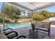 Covered patio with a view of the pool and fenced-in backyard at 203 E Sweetwater Creek Dr, Longwood, FL 32779