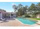 Swimming pool and patio area with backyard views at 203 E Sweetwater Creek Dr, Longwood, FL 32779