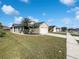 The front yard has grass, a driveway, and plants in the front yard at 2134 Jessa Dr, Kissimmee, FL 34743