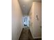 Hallway with neutral walls, carpeted floors, and doorways leading to other rooms at 2903 Edenshire Way # 108, Kissimmee, FL 34746