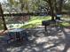 Lakeside picnic area with table and grill in a leafy setting at 2903 Edenshire Way # 108, Kissimmee, FL 34746