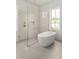 Bright bathroom featuring a glass enclosed shower, a soaking tub, and natural light at 3011 Amherst Ave, Orlando, FL 32804