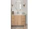 Stylish bathroom vanity with modern fixtures, unique mirror, and ample storage at 3011 Amherst Ave, Orlando, FL 32804
