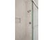 Bright bathroom features a modern shower with vertical tile and built-in niche at 3011 Amherst Ave, Orlando, FL 32804