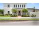 Charming two-story home with landscaped yard and a striking white exterior at 3011 Amherst Ave, Orlando, FL 32804